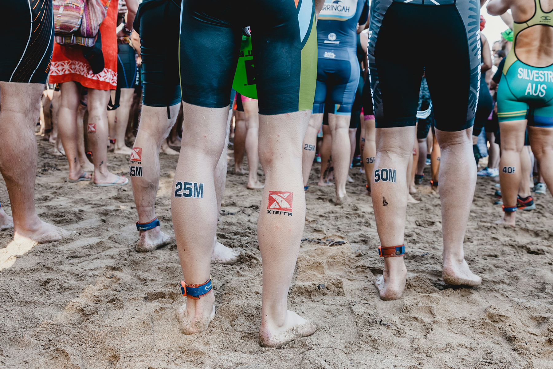 People running by the beach